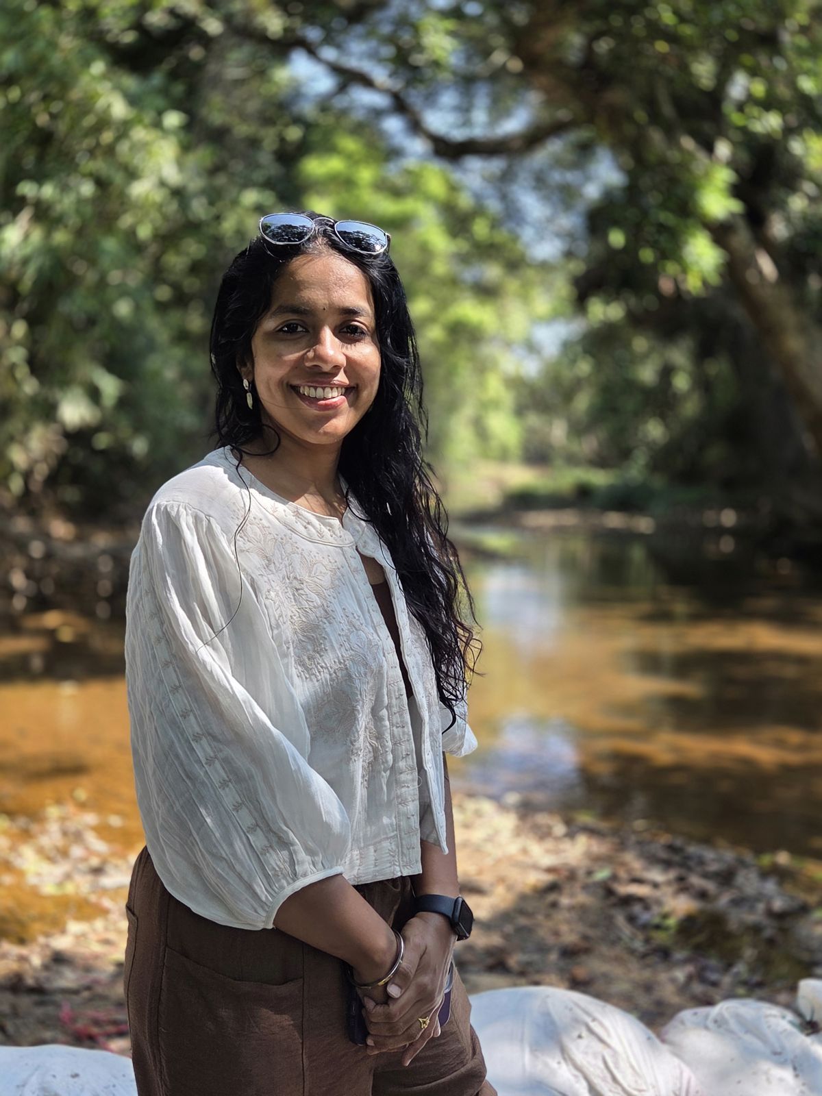 Deepika Arun by a forest stream